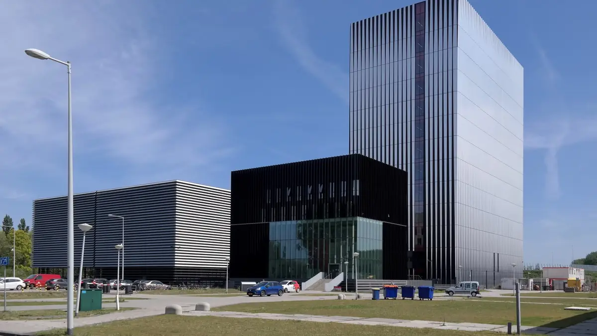 The Equinix AM3 and AM4 colocation data centre buildings in Amsterdam, a low-rise block beside a taller tower